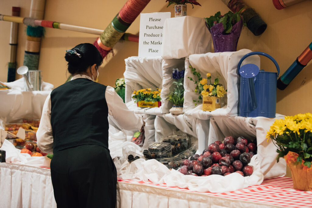 Woman arranging fruit