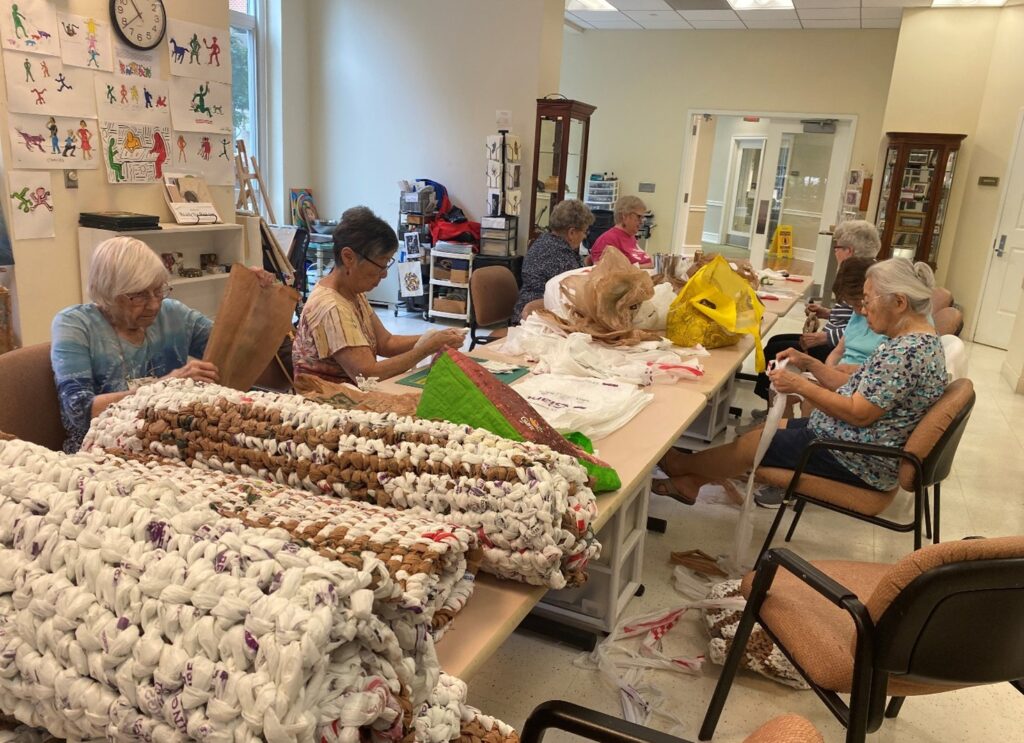 Residents meet weekly in the art room at Goodwin House Bailey’s Crossroads to make mats.
