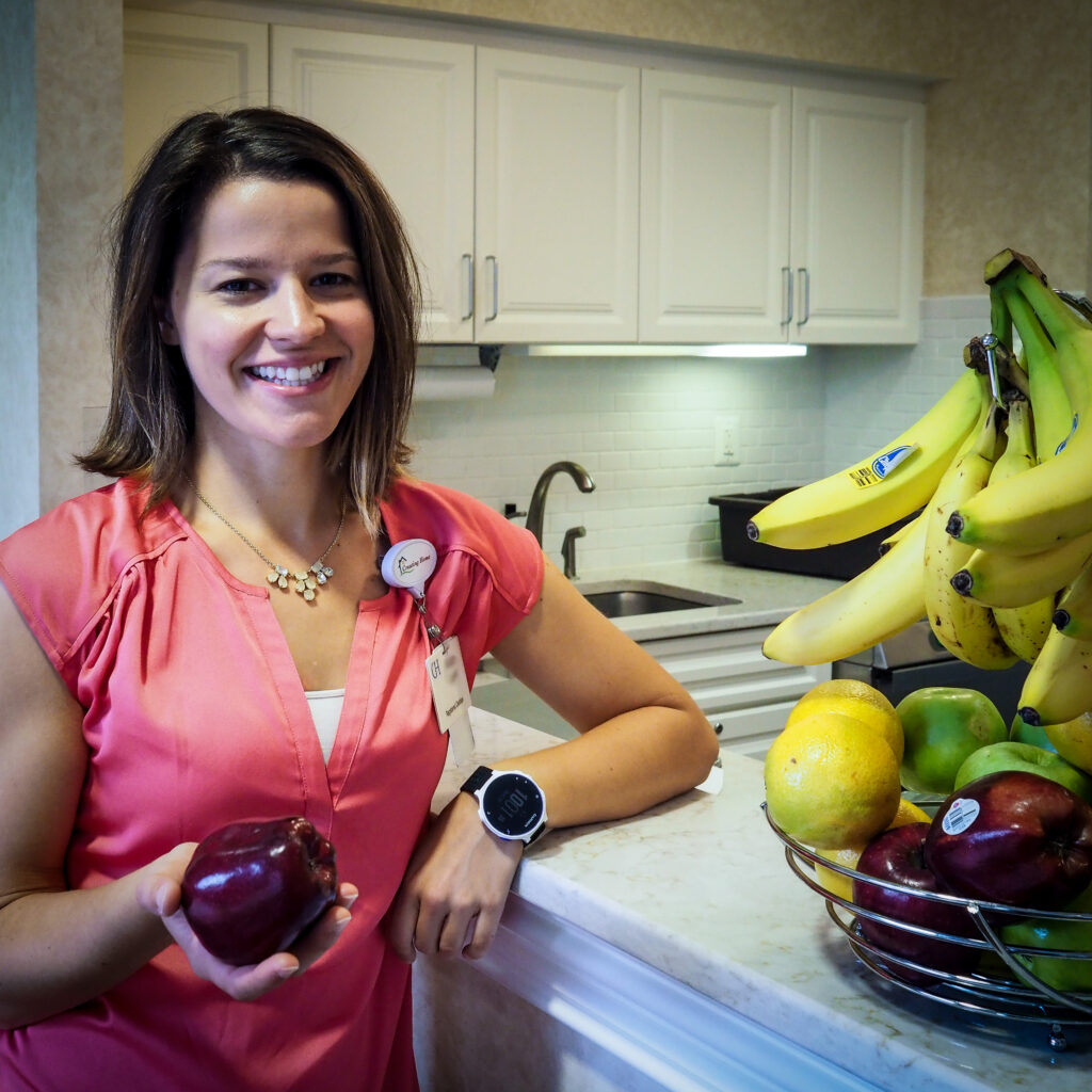 Woman holding fruit